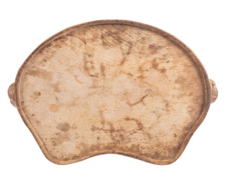 A carved oak tray, workshop of Robert 'Mouseman' Thompson, mid 20th century; of kidney form, with mice forming the handles at