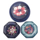 Three pieces of Walter Moorcroft pottery comprising a stand tube lined in the Anemone pattern on