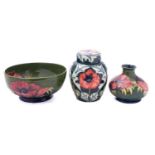 A Moorcroft pottery jar and cover tube lined in the Poppies pattern,