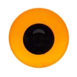An art glass dish of shallow circular form of vivid orange colour with circular black centre,