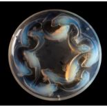 A Lalique shallow bowl Matigues the opalescent body moulded to the underside with twelve swirling