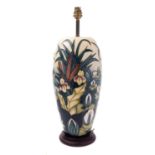 A Moorcroft pottery lamp base, tube lined in the Lamia pattern, after the original by Rachel Bishop,