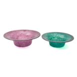 Two Monart glass bowls of flaring circular form one of mottled swirling purple colour with