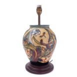 A Moorcroft pottery lamp base, tube lined in the Trout pattern, after the original by Philip Gibson,