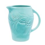 A Susie Cooper pottery jug moulded with flowers and foliage on a matt green ground,