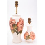 Two Moorcroft pottery lamp bases, tube lined in the Coral Hibiscus pattern, impressed marks,