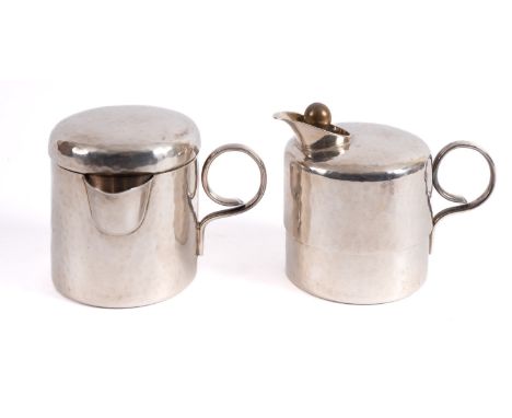 A WMF silver plated hot water jug and cream jug, early 20th century; both with planished body and looped side handle, stamped
