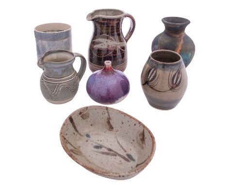 A mixed group of studio pottery, comprising a Pat Armstrong raku fired stoneware vase under copper fuming, a Dartington Potte