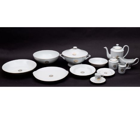 A Limoges porcelain dinner, tea and coffee service, for twelve settings, with gilt trim and central medallion, gilt Phoenix m