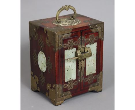 A Chinese brass-mounted hardwood jewellery cabinet fitted three long drawers enclosed by a pair of panel doors, inset with pi