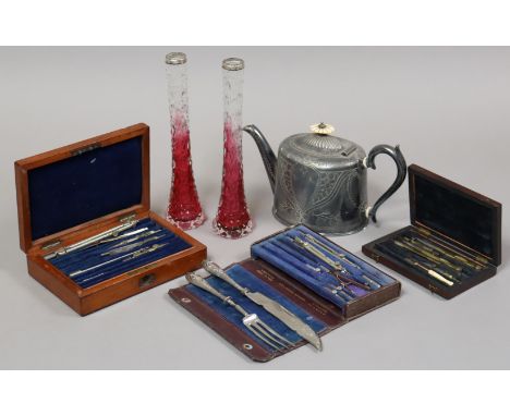Three vintage part sets of drawing implements each set cased; an engraved Britannia metal oval teapot; a fish knife &amp; for