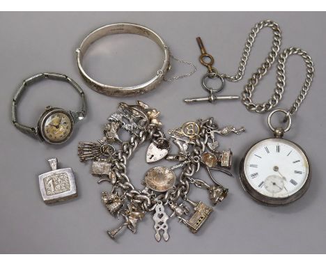 A vintage silver charm bracelet with numerous silver &amp; white-metal charms (3oz); an art deco ladies’ wristwatch in 925 si