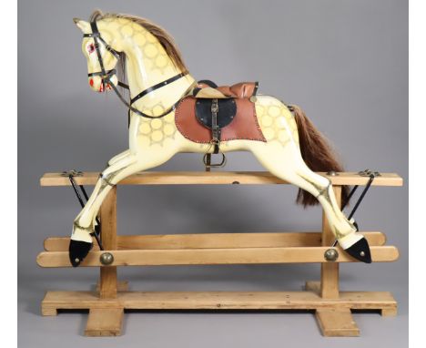 A DAPPLE-GREY PAINTED WOODEN ROCKING HORSE with horse-hair tail &amp; mane, glass eyes, leather saddle &amp; bridle, on pine 