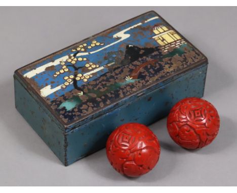An early 20th century Japanese enamelled tin rectangular trinket box with polychrome landscape decoration to the lid &amp; an