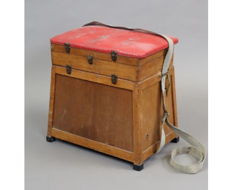 A fisherman’s wooden box-seat fishing box, 36cm wide, containing four fishing reels, various lures, etc; together with a maho