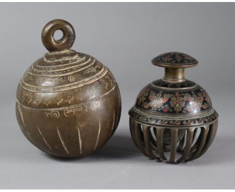 A Tibetan bronze spherical pendant bell with engraved inscriptions &amp; decorative borders, 14cm high; &amp; a similar Benar