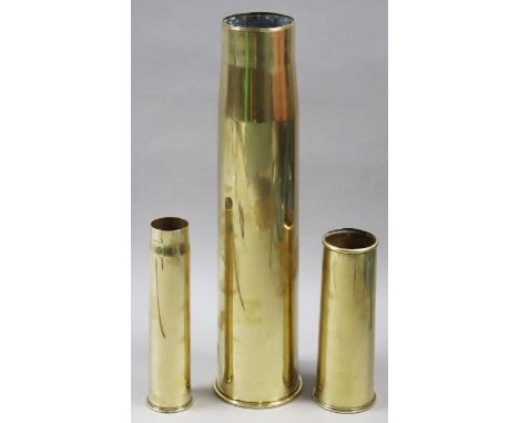 Three vintage brass military shell-cases, converted to stick-stands/vases.