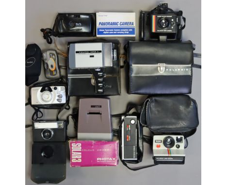 Two vintage Polaroid cameras; a Halina Super 8 cine camera ; a Kodak Instamatic 233 camera; &amp; various other cameras &amp;