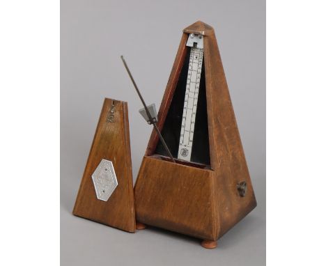 A Maelzel metronome in a mahogany case, 23cm high.