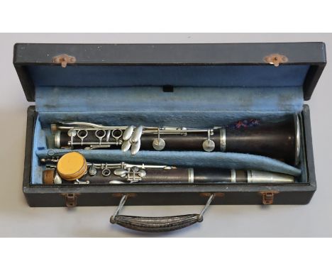 A French clarinet by Dolnet dlp of Mantes, 66.5cm long, cased.