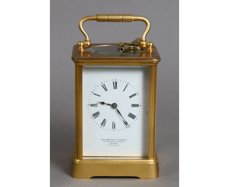 A French brass-cased carriage clock the white-enamel dial with black roman numerals &amp; signed “Goldsmith’s company 112 Reg
