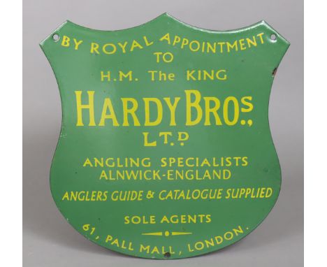 An enamelled shield-shaped sign “HARDY BROS LTD ANGLING SPECIALISTS ALNWICK ENGLAND”, 30cm wide x 30cm high.