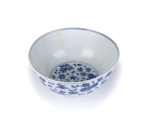 Blue and white bowl Chinese, 18th Century decorated to the exterior with flowers and butterflies, six character Kangxi mark t