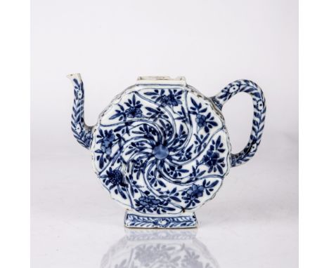 Blue and white teapot Chinese, Kangxi period (1662-1722) with a moulded body painted with a central flower, with further pane