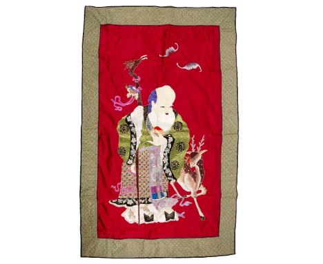 Large embroidered panel of Shulao Chinese the standing figure set on a silk red ground, overall size 140cm x 87cm