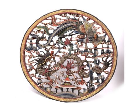 Carved wooden panel Chinese, 20th Century decorated in polychrome colours, with pierced carving depicting dragon in flight , 