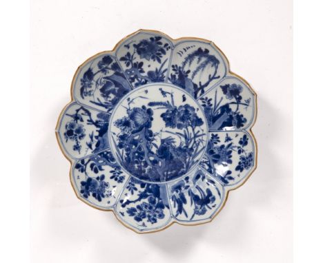 Blue and white lotus shaped dish Chinese, Kangxi (1662-1722) painted with flowers and insects within a panelled border and ca