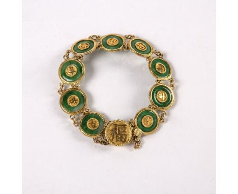Jade panel bracelet Chinese, circa 1920s the jade disc with applied characters in gold, the clasp stamped 20 WH, probably for