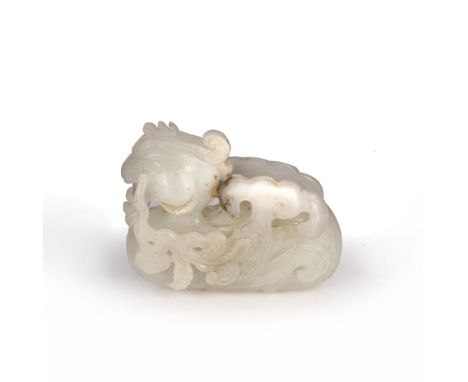 Jade carving of a phoenix Chinese carved in a recumbent position grasping a branch in the beak, 6cm across Condition: general