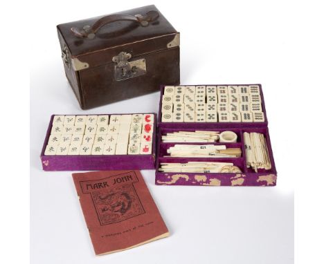 Bone and bamboo mahjong set Chinese in a leather case, 19cm wide Condition: worn and scratched and no key