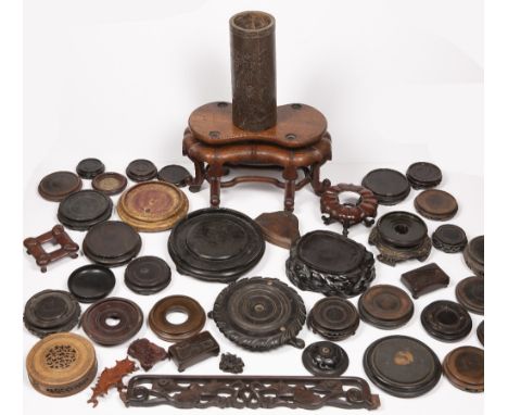 Group of stands and covers Chinese including a large shaped hardwood stand, 34cm x 20cm high Condition: There is one cover in