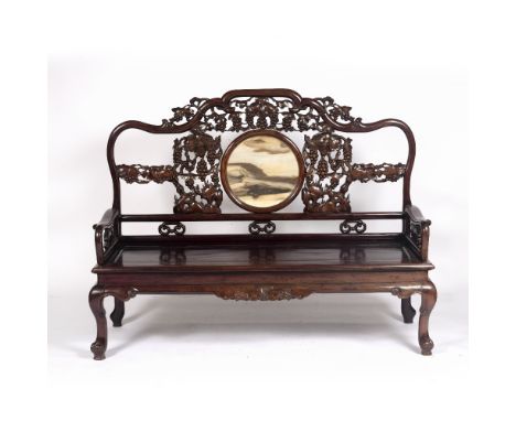 Large hardwood hall bench Chinese, late 19th Century with inset circular dreamstone panel to the back, and carved with auspic