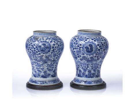 Pair of blue and white inverted baluster vases Chinese, Kangxi period (1661 - 1722) each painted with scrolling foliage and b