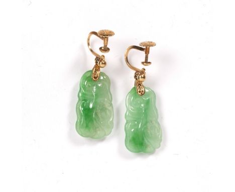 Pair of jade earrings Chinese carved as an animals, suspended by a gold metal backing stamped 18k,  jade 2cm across (2) Condi