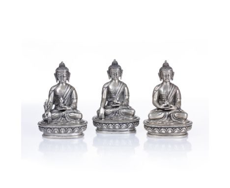 Trio of small white metal Buddhas Sino-Tibetan to include Bhaisajyaguru, Shakyamuni and Dpankapa, approx 8.5cm high Condition