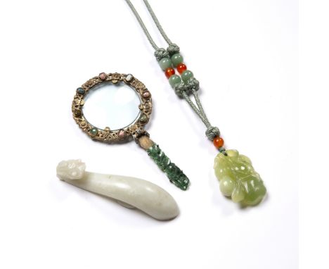 Jade belt buckle Chinese of dragon form,10cm, a green hardstone and jade pendant necklace and a jade and coloured stone inset