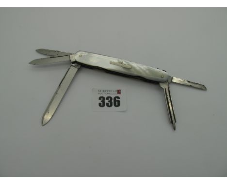 A George Butler &amp; Co (Art) Knife, with four blades and  nail file, mother of pearl scales, brass linings, workback to spr