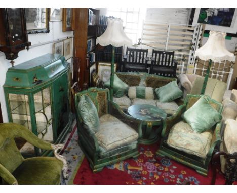 A LATE 1920S GREEN CHINOISERIE DECORATED SITTING ROOM SUITE, comprising: A Bergere two seater sofa with two armchairs (with o