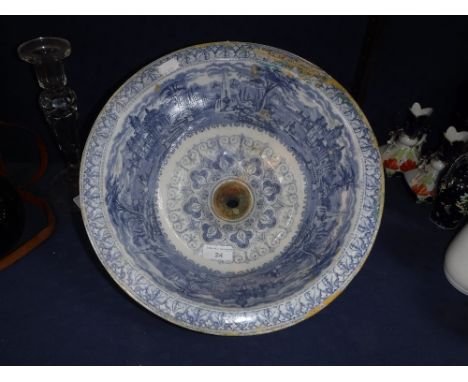 A 19TH CENTURY TRANSFER DECORATED CIRCULAR WASH BASIN with plug-hole, 12.5" dia