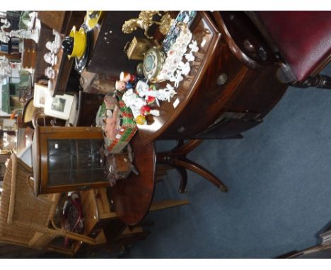 A 19TH CENTURY BOW FRONTED MAHOGANY COMMODE, a reproduction mahogany circular table and a small glazed corner cupboard (3)