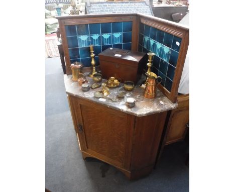 AN EDWARDIAN LIGHT OAK CORNER WASHSTAND with rouge marble top and Arts & Crafts green tiled splash-back
