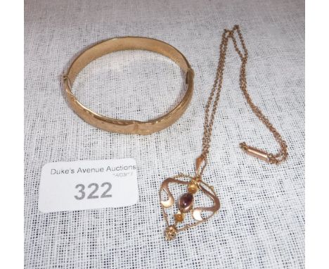 A 9CT YELLOW GOLD BANGLE and a pendant and chain