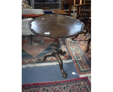 A GEORGE III MAHOGANY 'CHIPPENDALE' STYLE TRIPOD TABLE, with pie-crust edge and carving to the cabriole legs