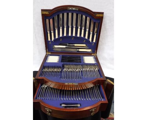 AN EDWARDIAN PLATED CANTEEN in an architectural mahogany case