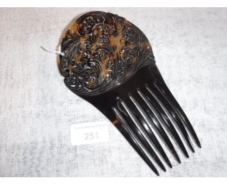 A 'TORTOISESHELL' MANTILLA TYPE COMB with carved and pierced decoration