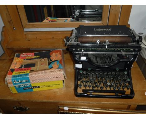 A 'VULCAN COUNTESS' CHILD'S SEWING MACHINE (boxed) and a vintage Underwood typewriter